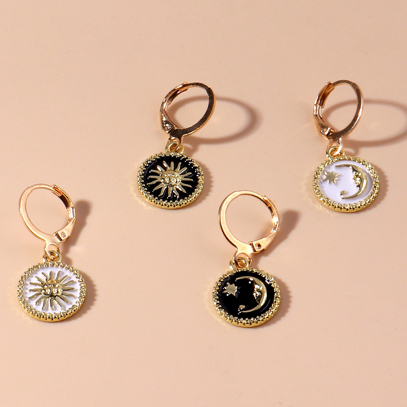 Fashion sun god moon pattern metal earrings