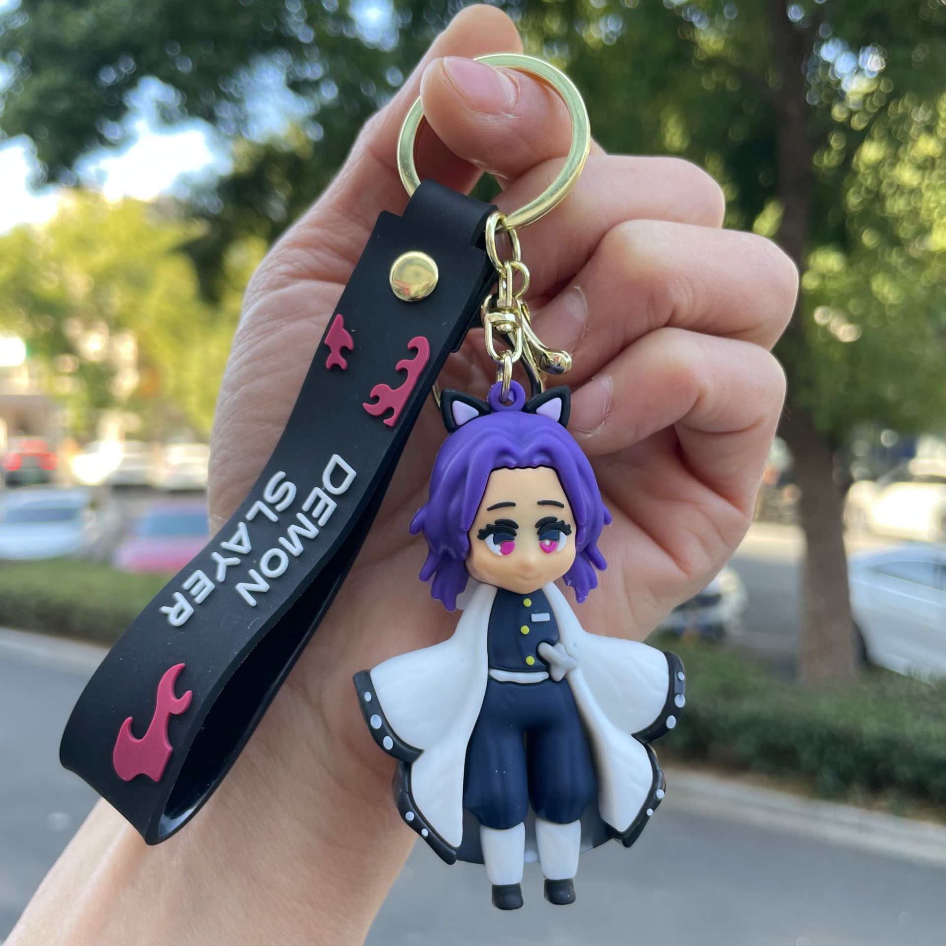 鬼滅の刃の鍵は自動車のキーチェーンの漫画の公仔のかばんのペンダントの子供機の小さい贈り物の卸売りを掛けます。