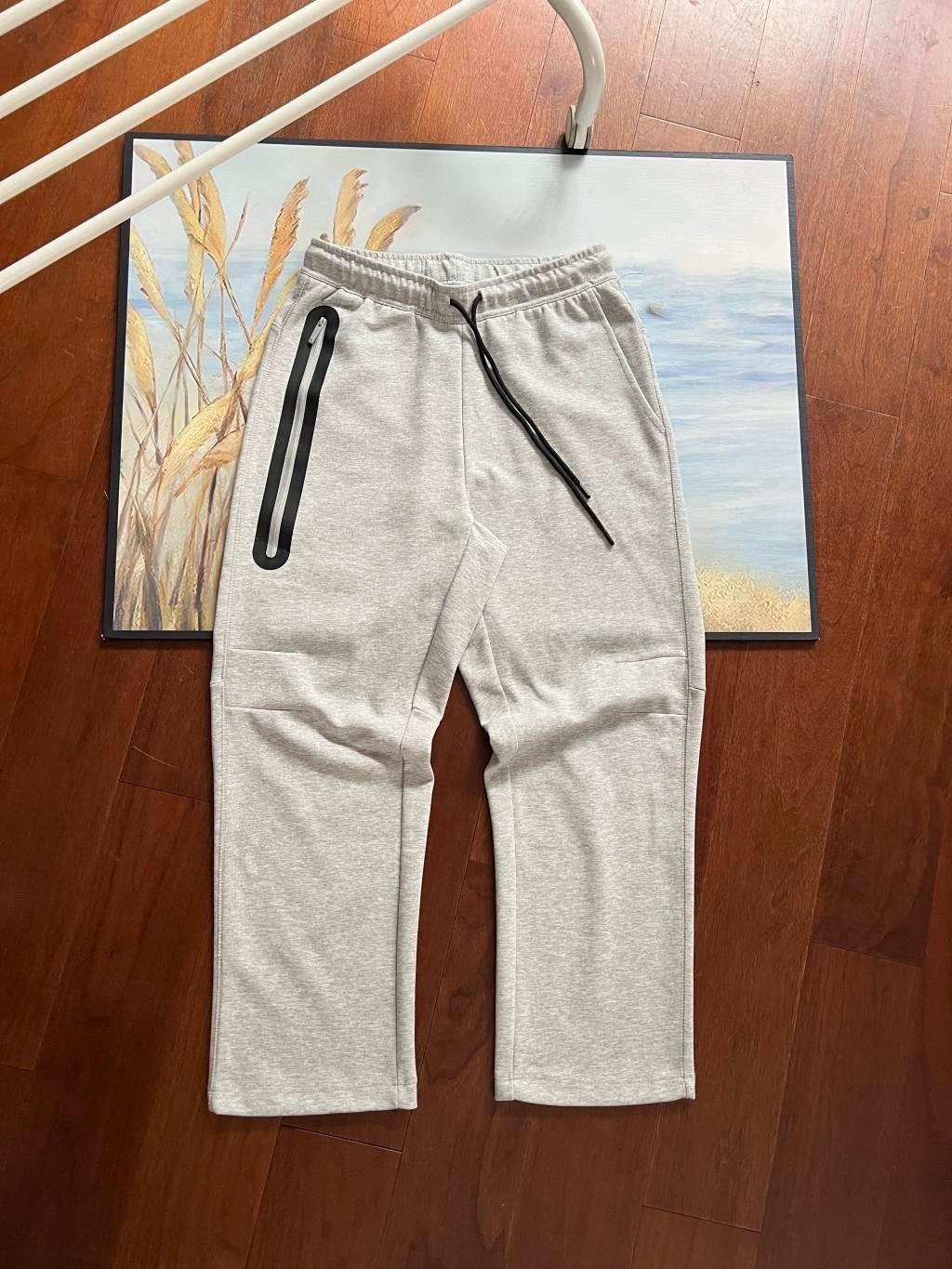 24 años de primavera y otoño para hombres nuevos pantalones de impresión rectos sueltos pantalones casuales de moda pantalones deportivos grandes pantalones de empalme