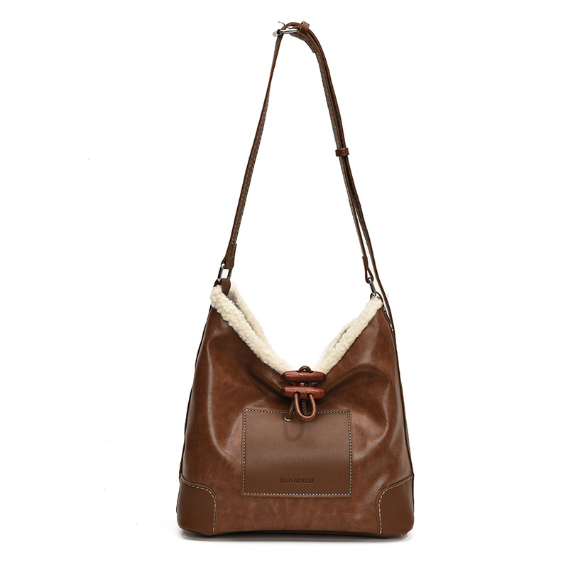 Bolsa de lana de cordero coreana debajo de la axila para mujeres 2025 nuevo estilo de bolsa de transporte de textura universal moda bolsa de transporte de mujer