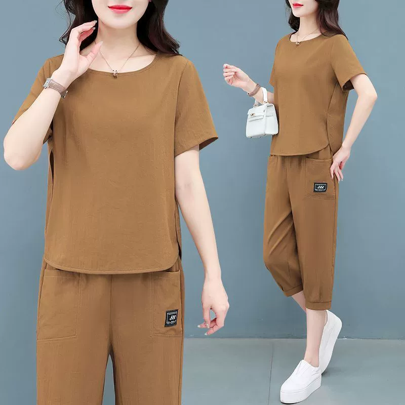 Спортивный костюм женский лето 2025 новый для женщин среднего возраста, молодящий, повседневный, с короткими рукавами, укороченные брюки, модный комплект из двух предметов