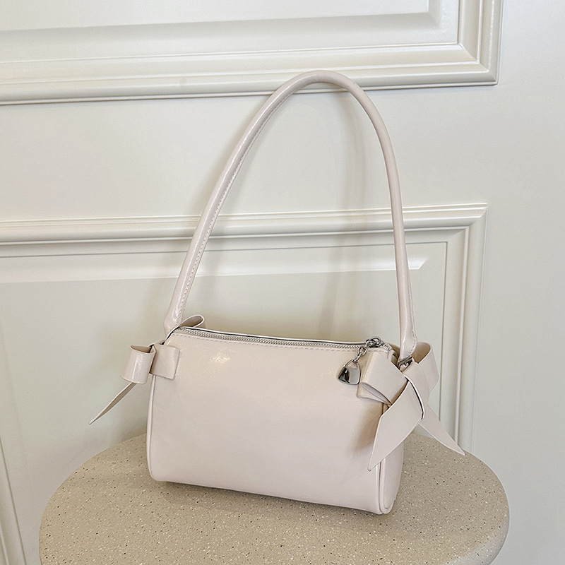 Bolsos de brazo de arco de arco de aire extranjero diarios para mujeres verano 2026 nuevo tipo de lujo ligero versátil bolso de hombro de viaje image 3