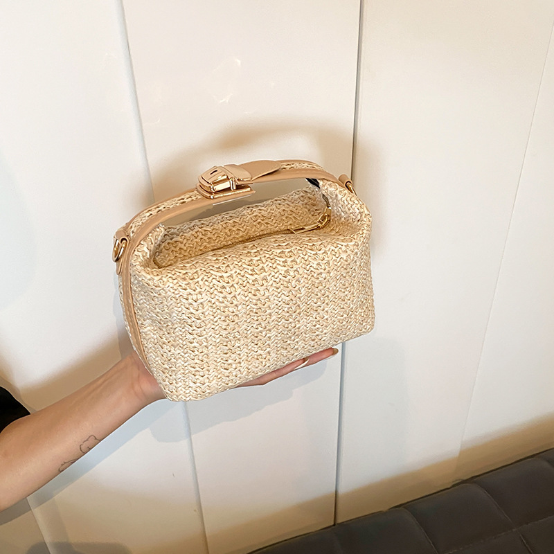 Bolsa de vacaciones de paja de estilo de verano para mujeres, nuevo nicho de diseño de hombro, bolso de mano, bolso de vacaciones de playa