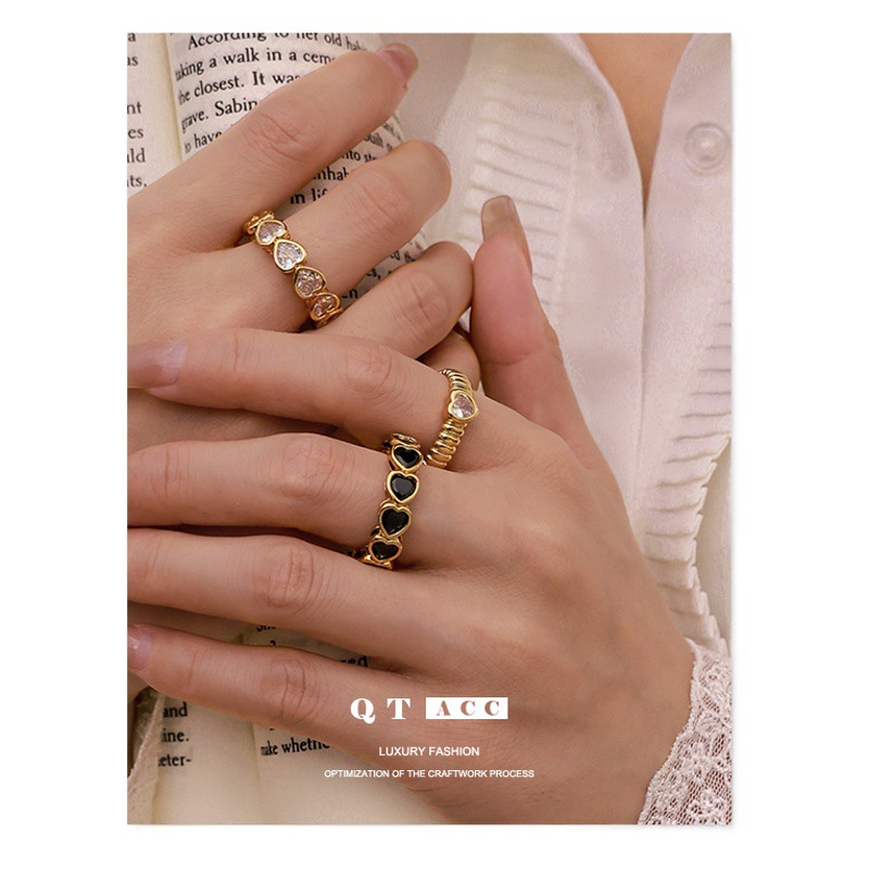 Latón chapado 18K oro real europeo y americano exagerado diseño hueco blanco y negro corazón circón anillo simple pulsera Retro