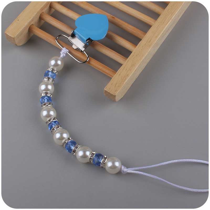 Nuevo bebé suministros melocotón corazón clip de hierro calmante bebé perla cristal chupete cadena anti-gota cadena chupete traje