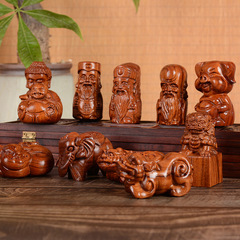 African Rosewood Handheld Carving of a Qilin with blessings of fortune, longevity, and prosperity, featuring a pig, an elephant, and a Buddha statue, a wooden decorative piece