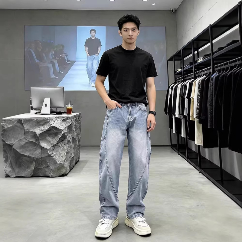 Washed blue slim-fit curved hem jeans for men, spring American style, cool and stylish pants, Xintang harem work pants wholesale