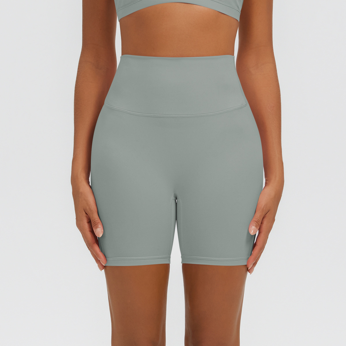 Nuevo tipo delgado de hielo, piel transpirable, ajustado, color sólido, ropa de yoga, pantalones cortos de tres puntos.