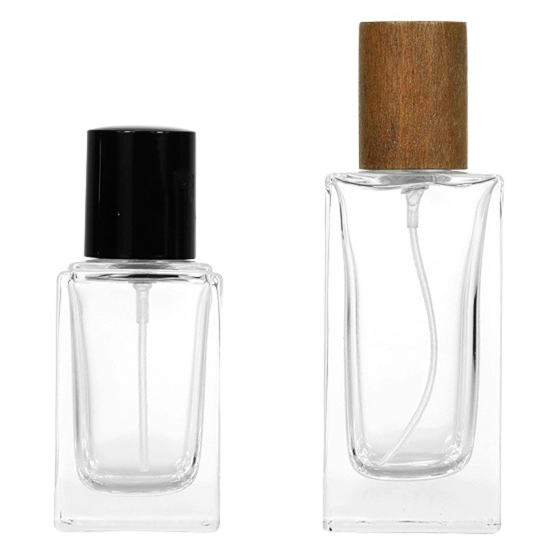 Perfume al por mayor botella de vidrio 30ml50ml botella de bayoneta cuadrada vintage Lotus cubierta de madera aerosol fino sub-botella portátil