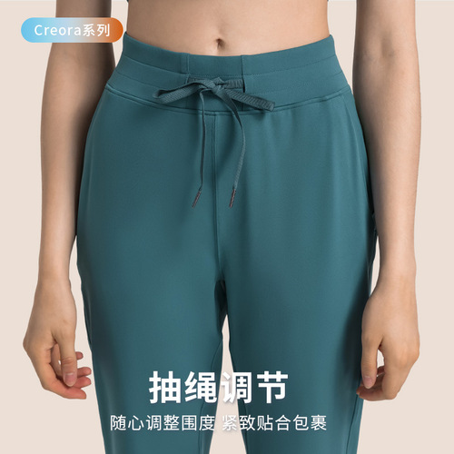 New drawstring high-waist butt-lifting nude sports pants for women, fashionable casual running fitness pants, loose and comfortable yoga pants