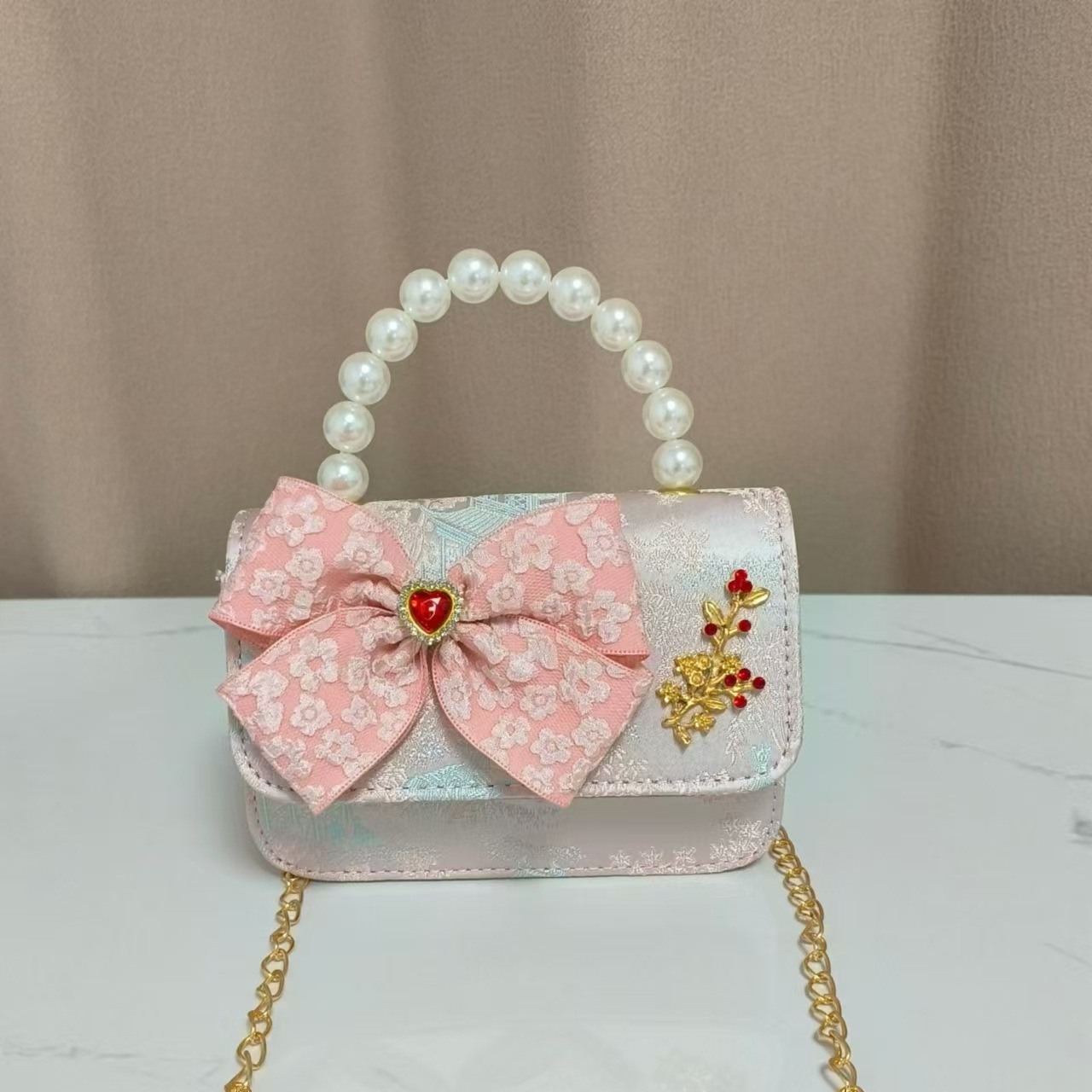 Bolso infantil nuevo bolso de hombro de niñas lindos bolsos de perlas de princesa arco de mariposa estilo nacional bolso de mochila pequeña bolsa