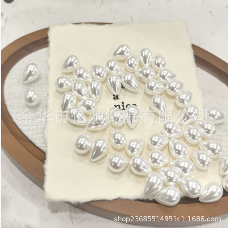 Imitación transfronteriza de perlas de casa imitación de conchas de agujero recto gotas de agua cuentas dispersas DIY accesorios de joyería pendientes colgantes para el cabello al por mayor