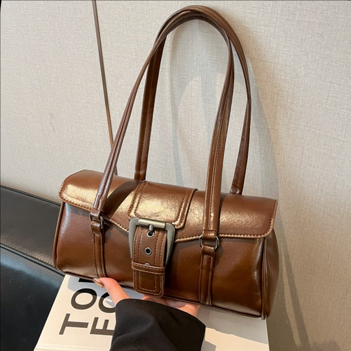 Nicho de alto nivel lujoso hombro bajo la braza bolsa de locomotora 2025 nuevo retro viaje bolso de palo de mujer