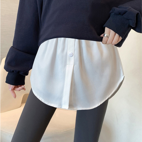 Sweatshirt base-layer magic: layered, oversized white A-line skirt with built-in bum-covering panel—perfect for fall and winter, even during pregnancy.