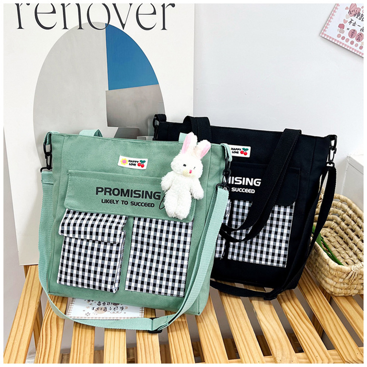 The new Korean-style cute nylon bag for class tutoring is a versatile checkered single-shoulder bag that is selling well (with a bear) undefined