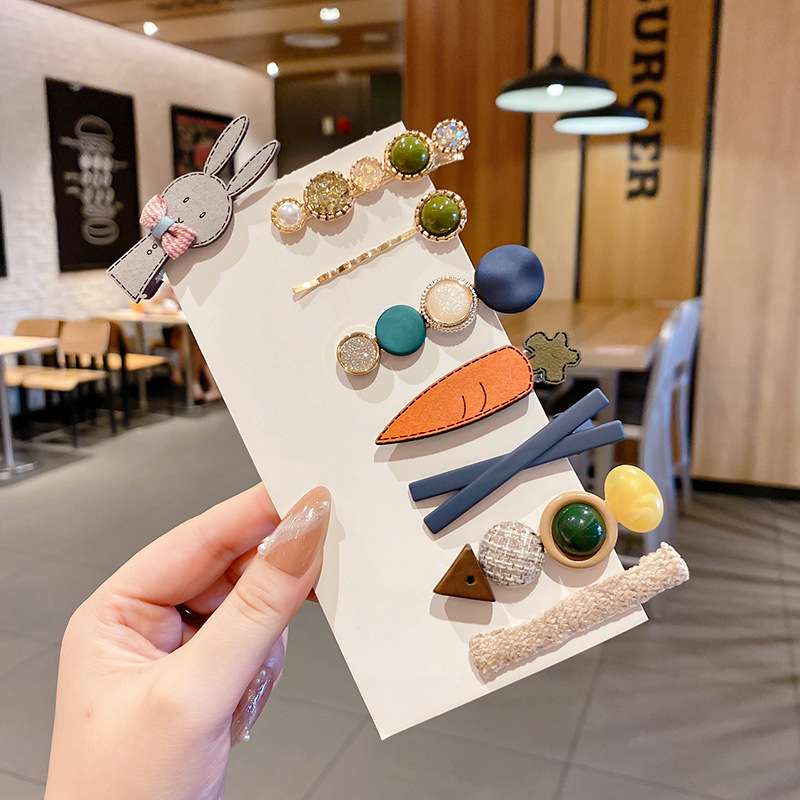 Clip de flequillo lateral rojo de la red femenina 2025 nueva horquilla simple clip de una línea horquilla clip de cabello roto tocado clip de pico de pato