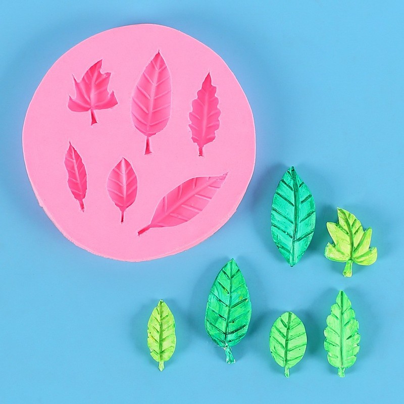 いくつかの草の葉のカエデの葉の形の液体のシリカゲルの鋳型のdiyはあめのケーキの石膏をひっくり返してゴムの鋳型を垂らします。|undefined