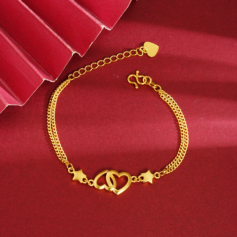 Arena oro pulsera corazón hueco doble corazón desgaste estrella de cinco puntas niñas fresco todo partido simple luz estilo de lujo Yiwu suministro