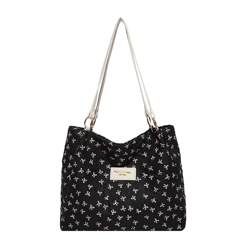 Bolso de tote 2025, primavera y verano, nuevo tipo de bolso de hombro, moda, bolso de mano, bolso de viaje de estilo extranjero para mujeres.
