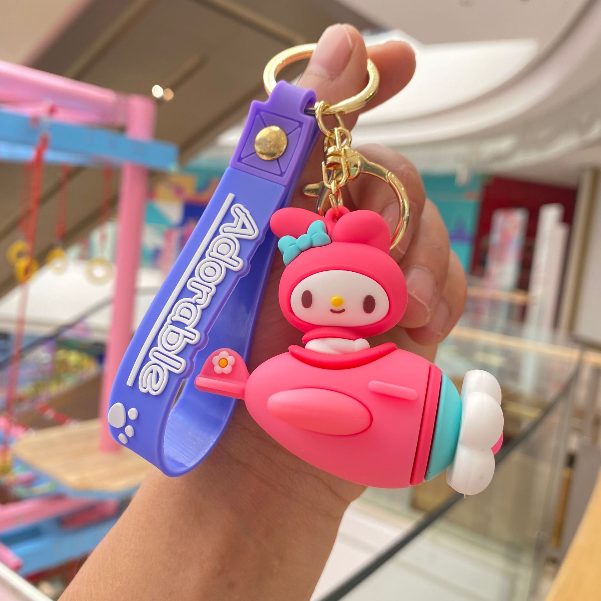 Creativo de dibujos animados Sanrio giratoria dulce avión llavero coolomi muñeca llavero pequeño regalo al por mayor