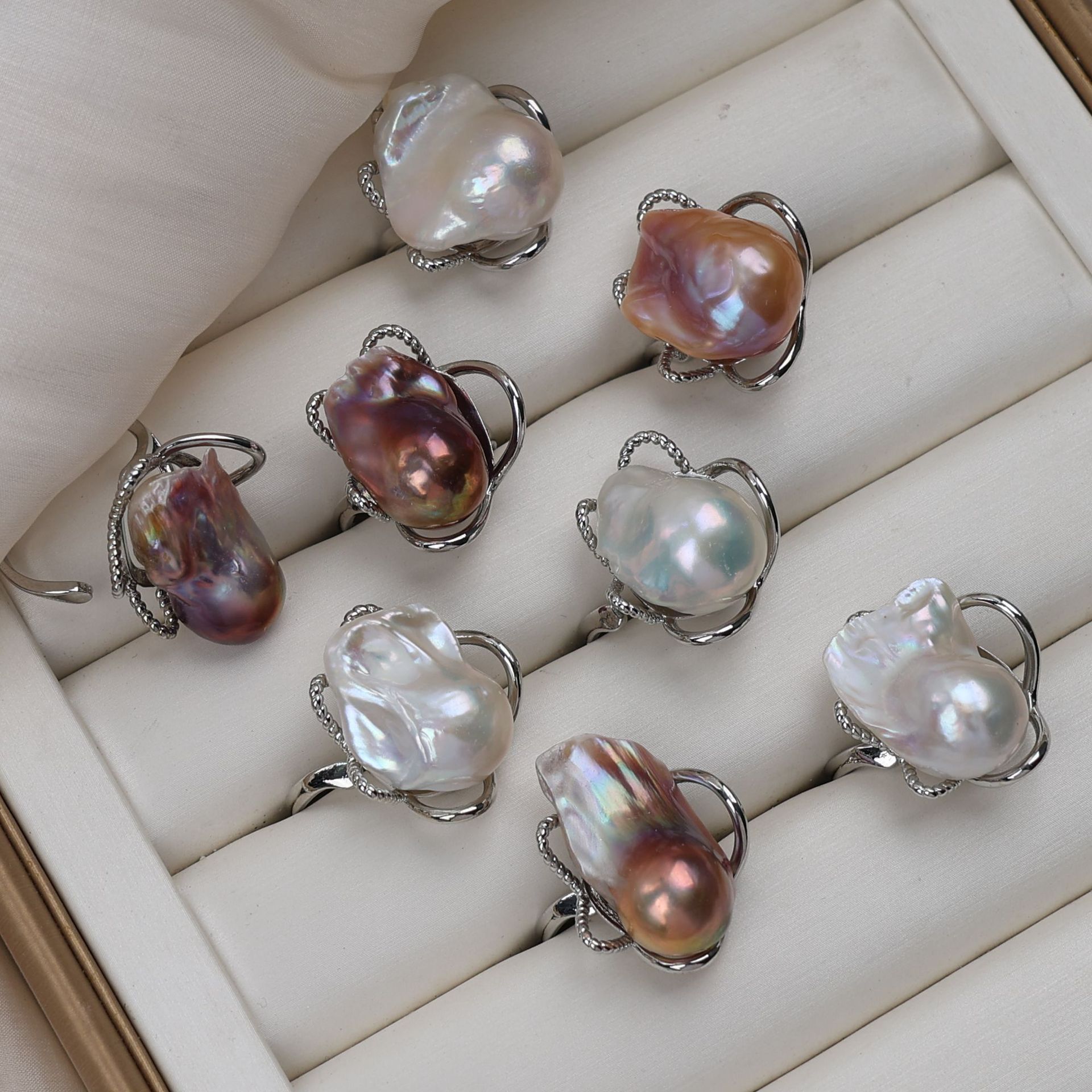 Natural freshwater pearl ring, featuring a fish-tail design, irregular shape, and a large baroque pearl with vibrant colors, offering a unique and stylish look