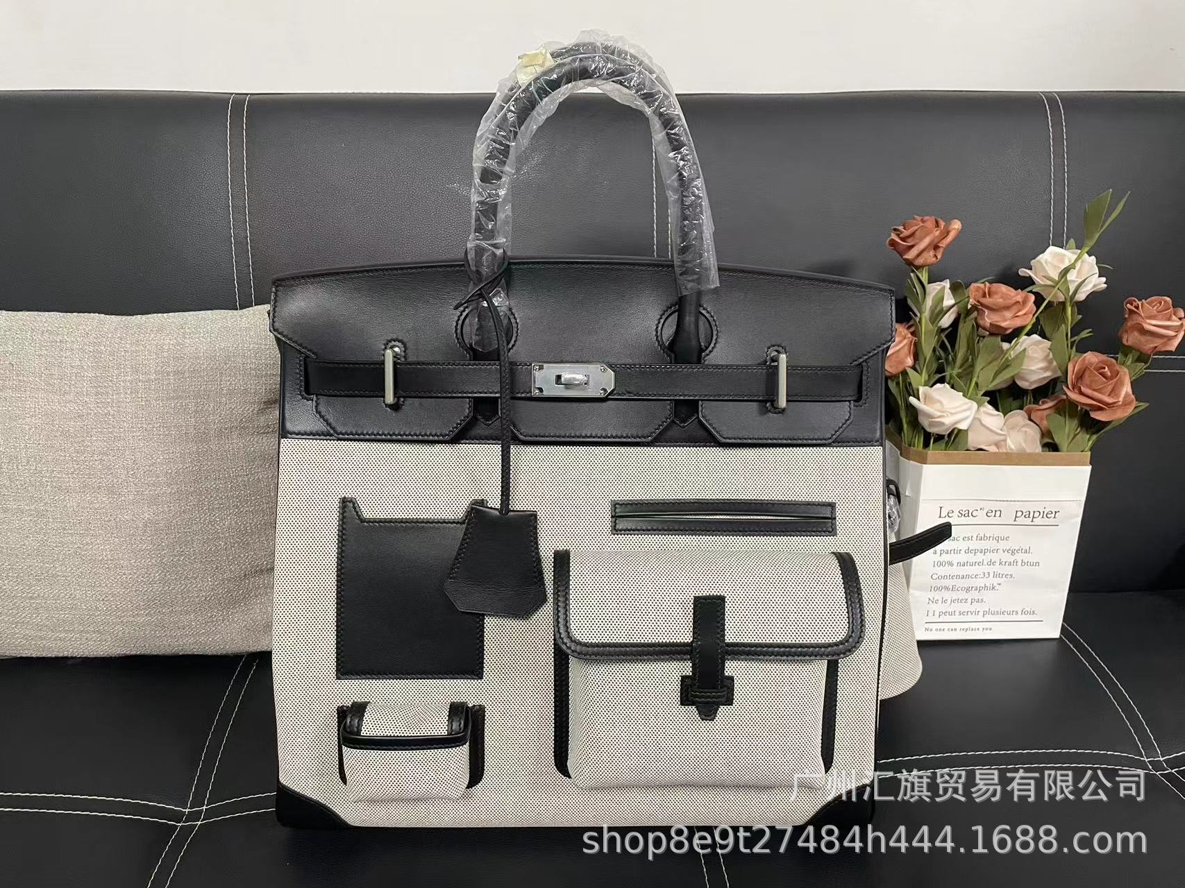 Bolsa de platino directa de fábrica Hac40 bolsas de viaje de color blanco y negro de gran capacidad pulsera de cuero de vaca real de hilo portátil