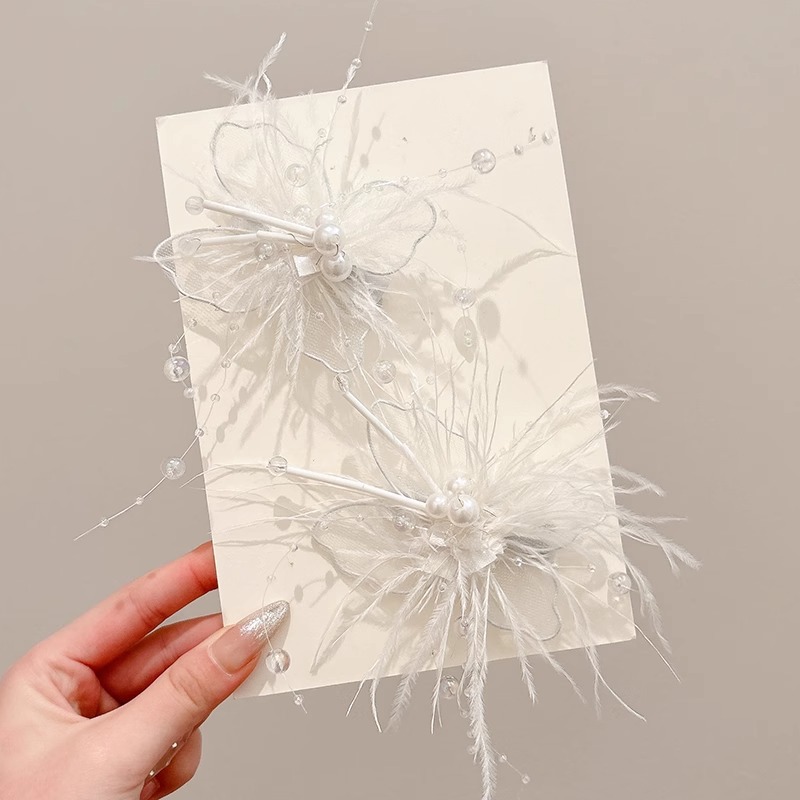 Pin de pelo de plumas blancas esponjosas mujeres 2025 nuevo clips lateral frisa de alto nivel sensación fría arco de viento tocado
