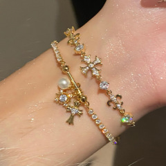 ジルコンのアイリスの花のクロスはブレスレットを調節できます。