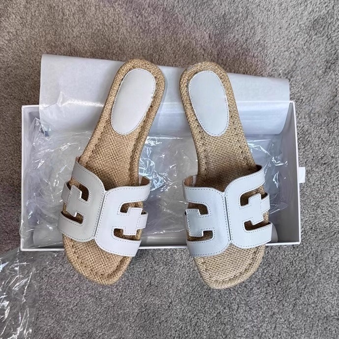 Inventario 2025 verano nuevo color retro tela de paja plana en una palabra H zapatillas para mujeres nuevo estilo de estilo de vacaciones