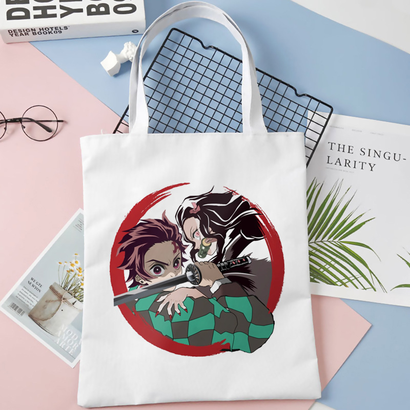 Comercio exterior transfronterizo Demon Slayer impresa bolsa de lona Harjuku bolsa de hombro bolsa de compras portátil de moda para estudiantes