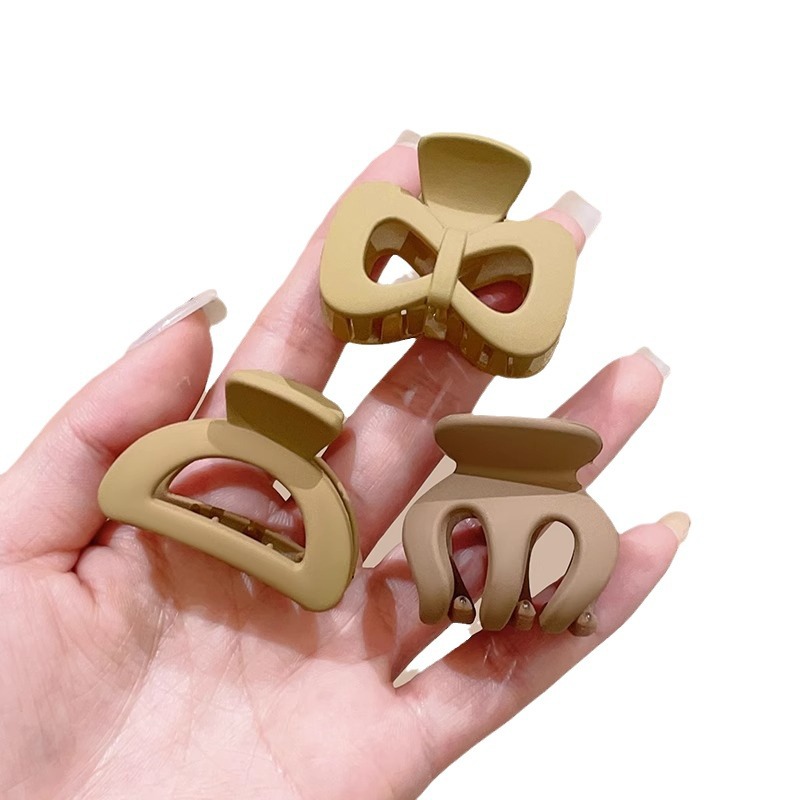 Artecimiento fijo de cola de caballo alta, cabeza de bola, clip de agarre pequeño de calabaza, mujer 2025 nuevo sombrero de clip de horquilla de sentido avanzado