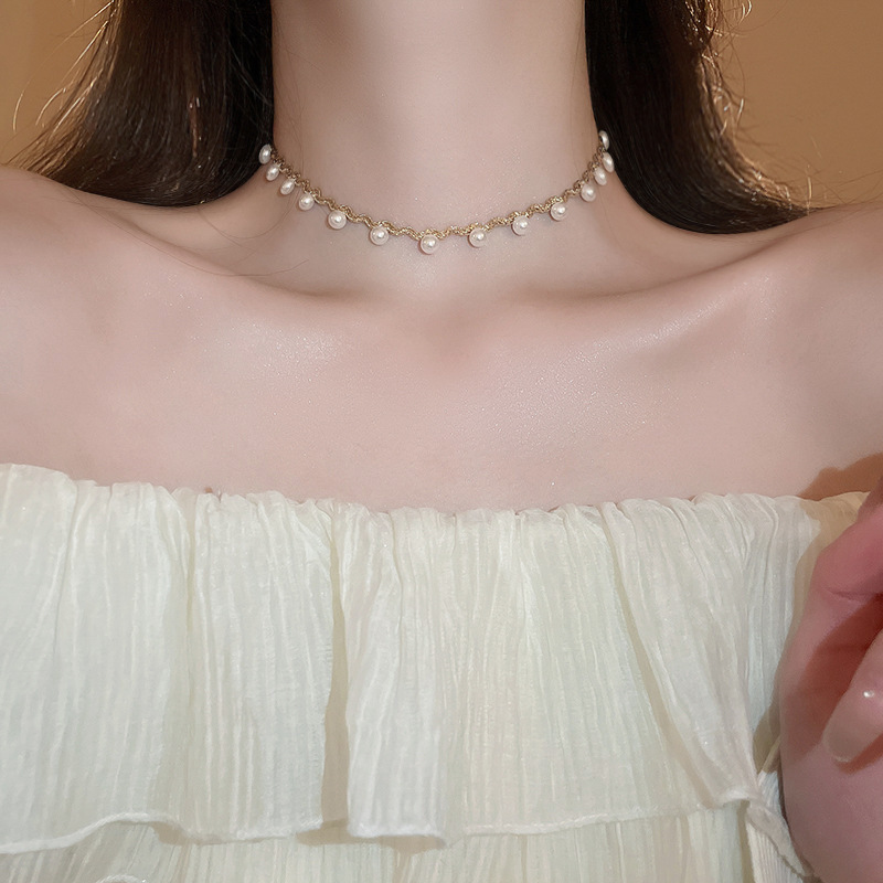 Collar de perlas con lazo de flor con cuentas francesas Elegante cadena de clavícula con sentido de alta gama retro ligero decoración de lujo femenino