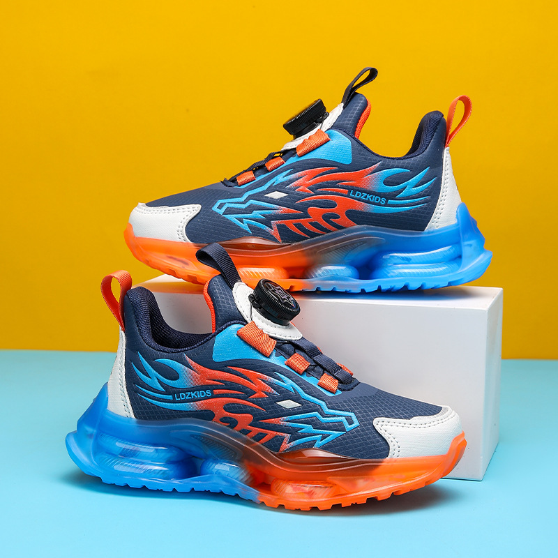 Zapatos primavera y otoño al por mayor medio y grandes zapatos para niños botón estudiante una pieza deportes malla de niño transpirable transporte giratorio