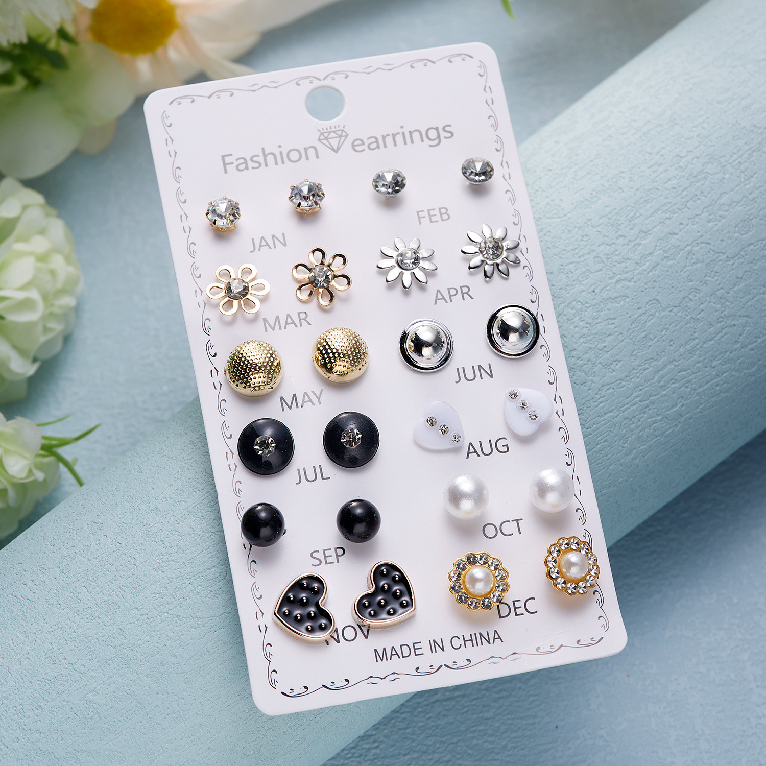 Set de aretes florales con perla y diamantes