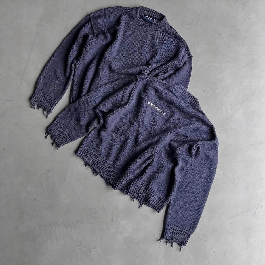 Estación independiente europea y americana otoño e invierno suéter rasgado hombres y mujeres costura de cuello redondo marca de moda retro suéter suelto casual