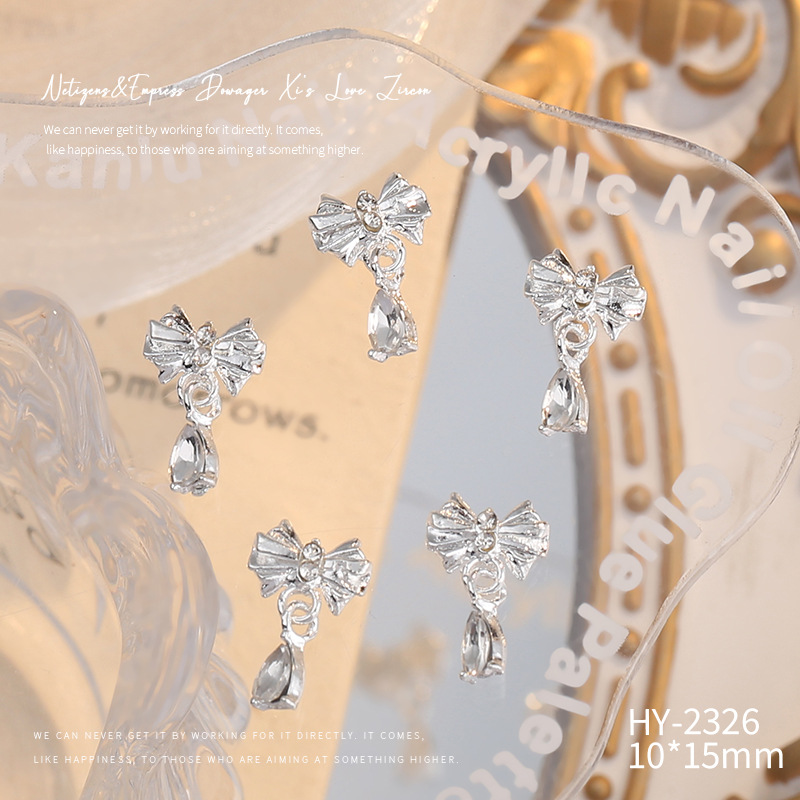 Nueva joyería de aleación de manicura completa diamante borla arco corona plata uñas manicura joyería accesorios al por mayor