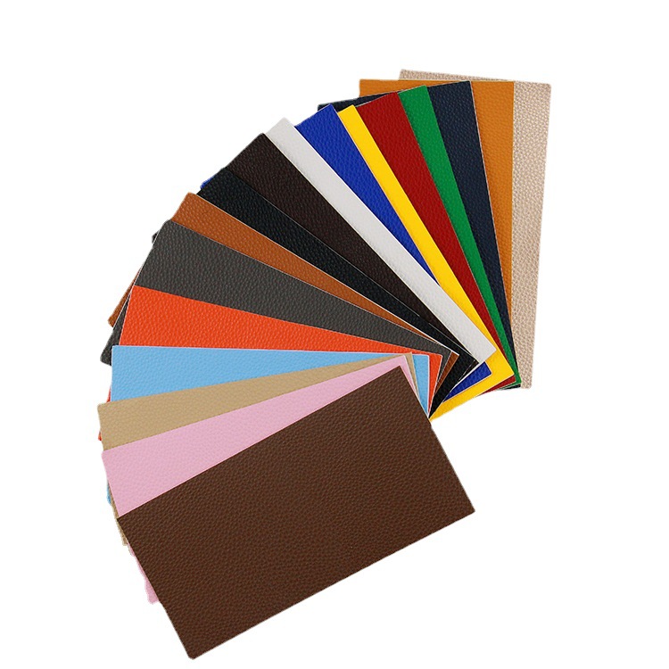 Los fabricantes suministran el subsidio de reparación de cuero de color autoadhesivo completo PU Litchi grano Road pegatinas sofá cojín agujero parche pegatinas