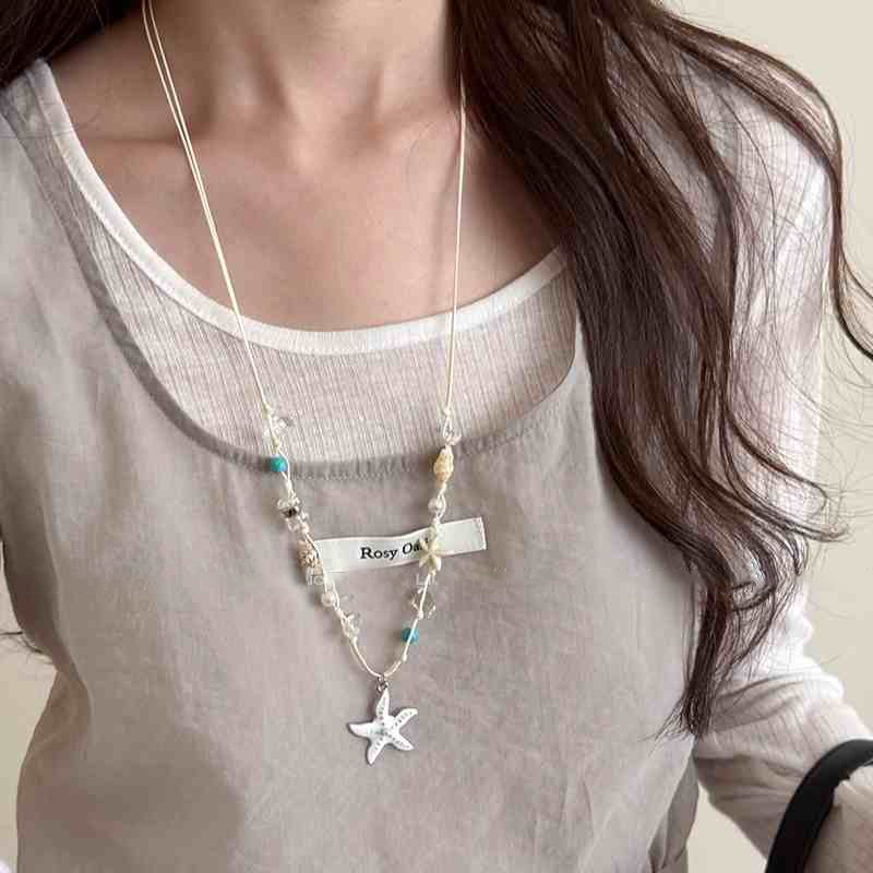 Cuerda de cera estrella de mar concha colgante de perlas collar vacaciones de verano estilo cadena de clavícula cadena de suéter de moda fresca y dulce mujer
