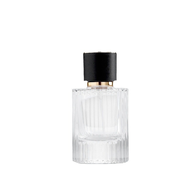 Venta al por mayor 30ml botella de dispensación de perfume cilíndrico 50ml botella de dispensación de loción de rayas verticales botella de rociador de presión botella de perfume