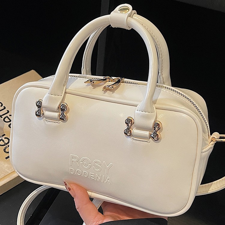 Bolsas de mano de moda populares para mujeres 2026 primavera nuevo estilo coreano sensación diaria bolsas de hombro para trabajar bolsas de viaje