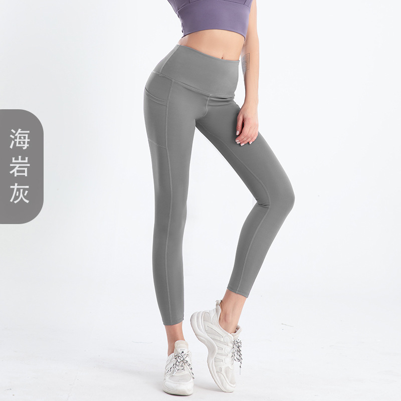 Amazon tamaño europeo pantalones de yoga transfronterizos bolsillo lateral de las mujeres melocotón cintura alta Levantamiento de cadera medias de fitness europeas y americanas