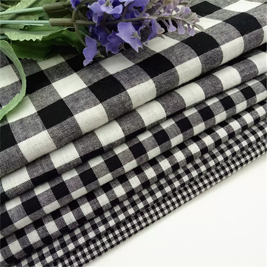 32s全棉色织黑白朝阳格衬衫连衣裙面料童装现货批发 纯棉色织布