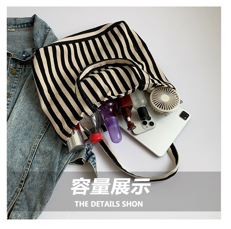 2024 Autumn/Winter new versatile and fashionable striped handbag shopping bag, two-tone large-capacity trendy single-shoulder bag undefined
