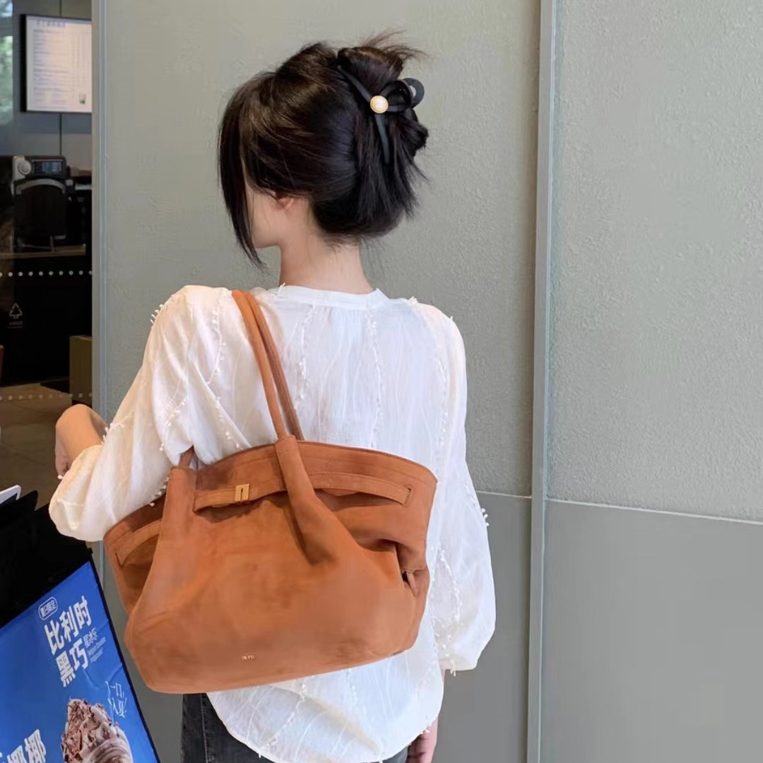 JW PEI Dumplings Bolso trapezoidal Pasaje de alta calidad Bolso de gamuza retro de gran capacidad Bolso de un solo hombro