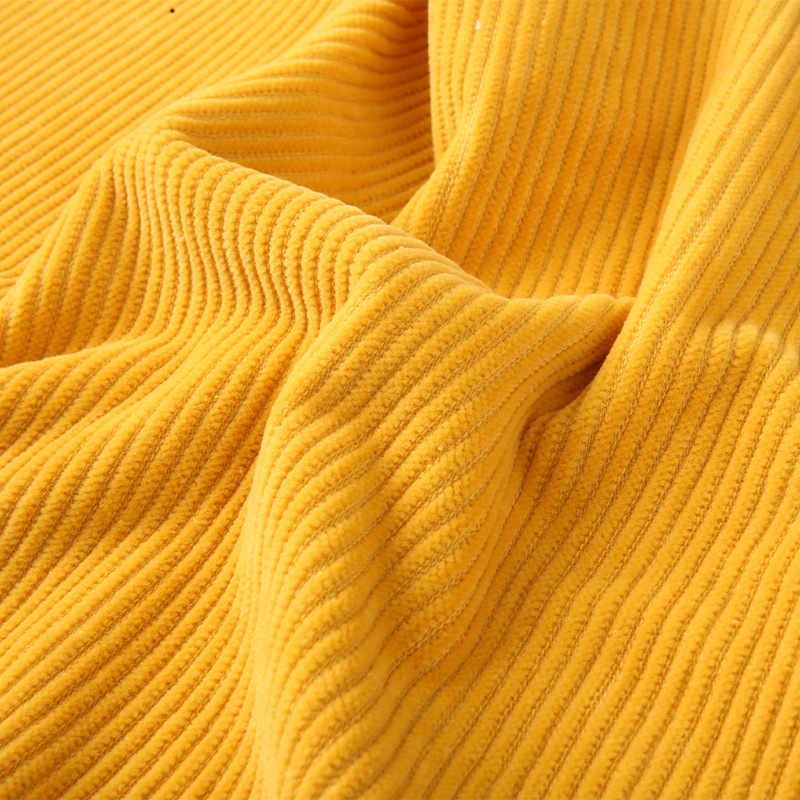 仿棉抱枕黄色灯芯绒面料童装裤子家纺氨纶布料弹力抽条粒粒绒供应