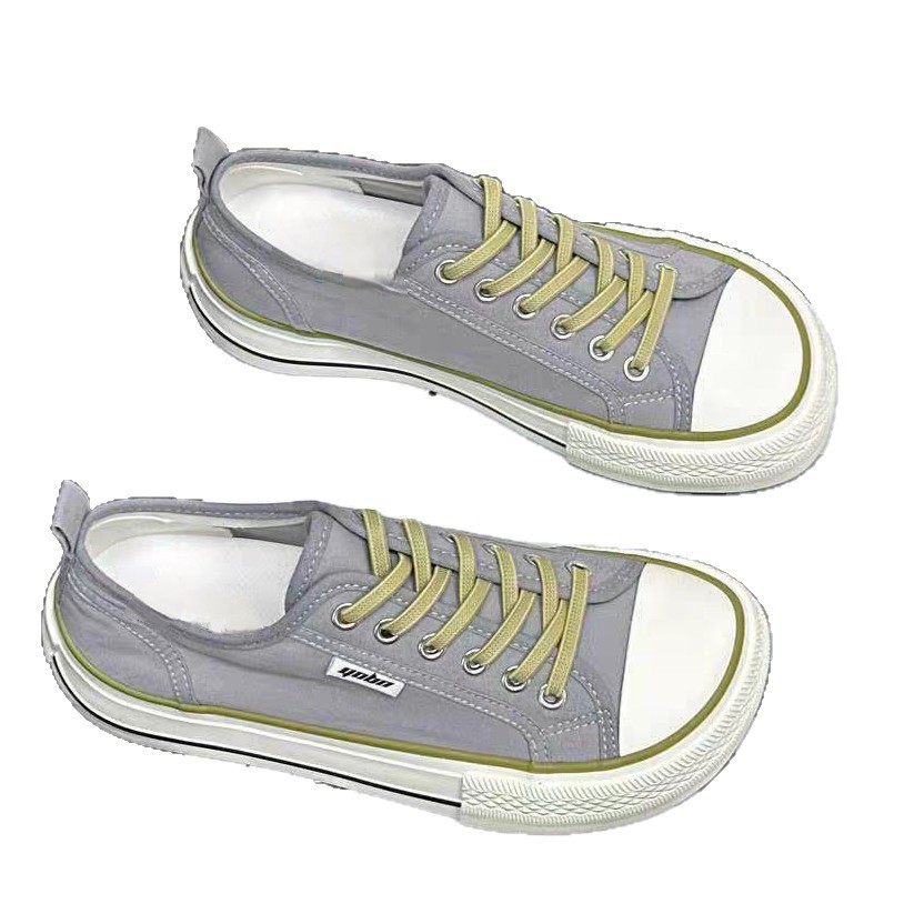 2026 primavera y verano nuevos zapatos de lona de mujer de altura baja con suela gruesa delantera correa de abertura superficial zapatos de lona casuales de estudiantes