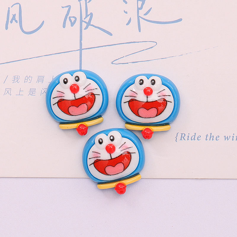 Dibujos animados lindo Jingdang gato expresión DIY caja del teléfono accesorios para el cabello crema pegamento material hecho a mano accesorios de resina al por mayor