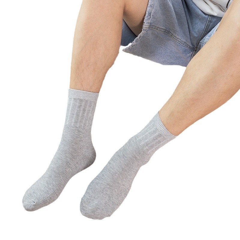 Calcetines de embalaje independiente para hombres calcetines de negocios calientes de otoño y invierno calcetines de algodón sólido regalos deportivos calcetines