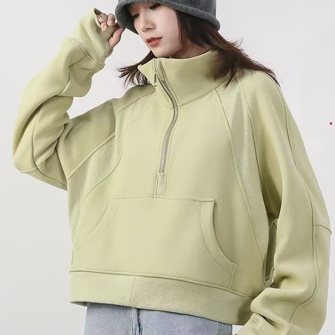 Otoño y invierno para espesar el estilo deportivo de mujer de cuello alto con semiacremallera suelta corta chaqueta de terciopelo de diseño de cuello vertical universal