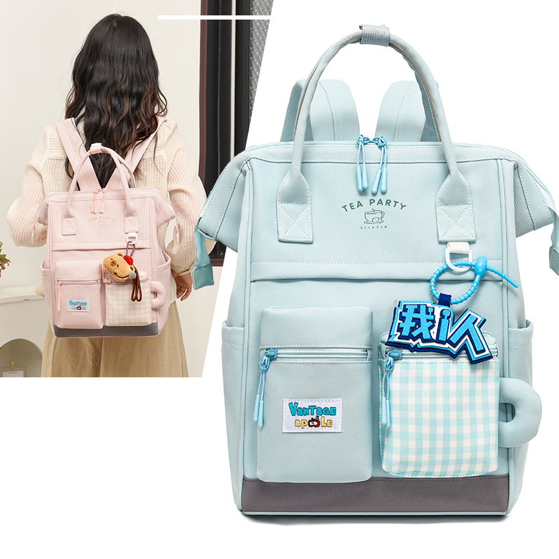Bolsa de maternidad estilo japonés, de gran capacidad y alta estética, mochila para estudiantes, bolsa de maternidad portátil para exteriores, mochila de doble asa al por mayor.